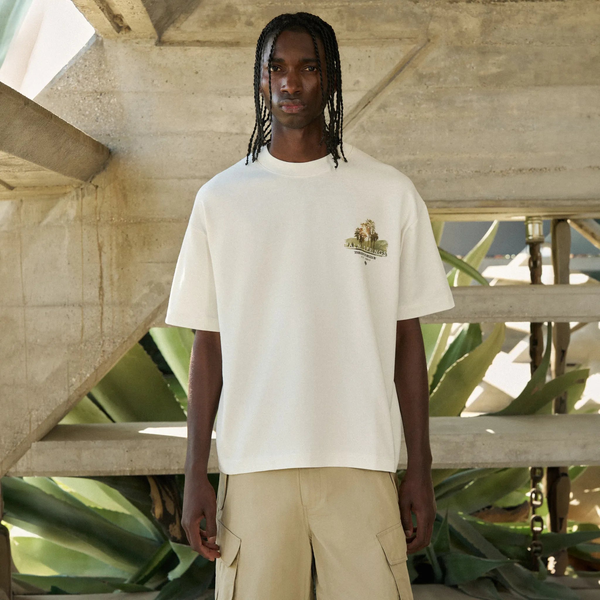 Model Front View of The Couture Club Palm Springs Graphic Off White T-Shirt